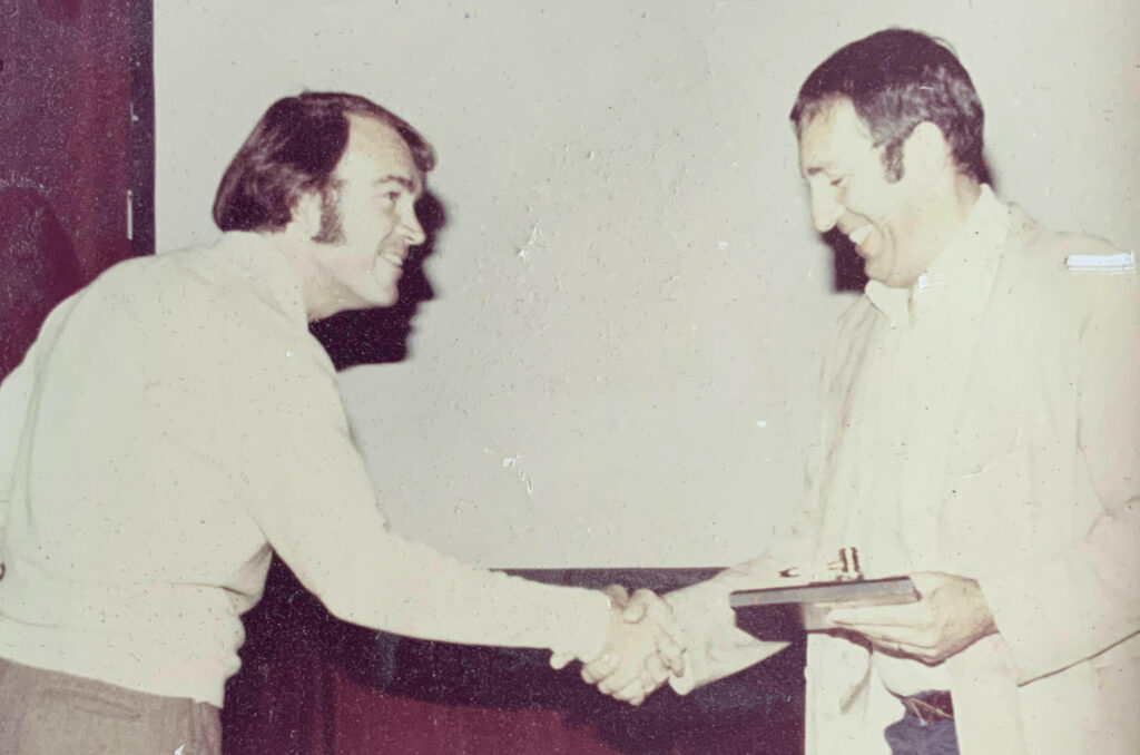 Lou Brown (right) transferring the TASH Board of Directors Chairmanship to Wayne Sailor (left).