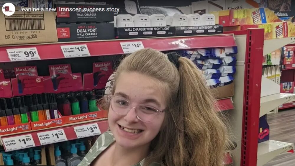 Jeanine smiling in the aisle of a store
